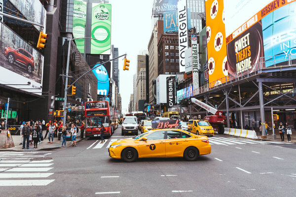 TIMES SQUARE, NEW YORK, USA - OCTOBER 8, 2018: urban scene with crowded times square in new york, usa