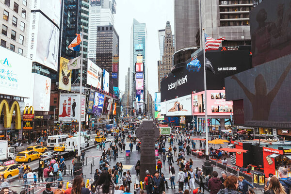 TIMES SQUARE, NEW YORK, USA - OCTOBER 8, 2018: urban scene with crowded times square in new york, usa