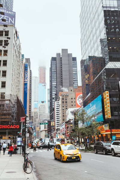 TIMES SQUARE, NEW YORK, USA - OCTOBER 8, 2018: urban scene with crowded times square in new york, usa