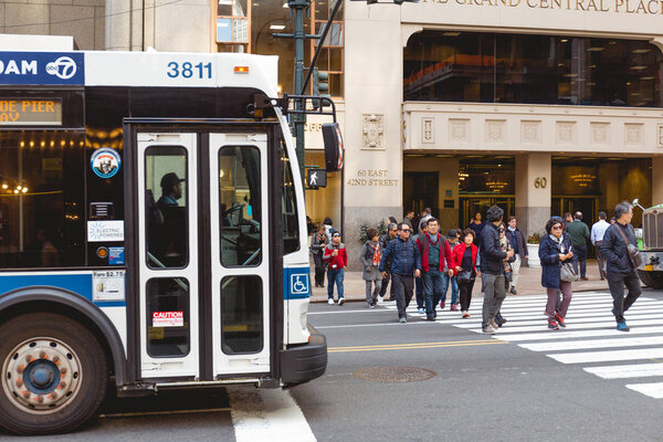 NEW YORK, USA - OCTOBER 8, 2018: urban scene of citizens crossing road in new york, usa