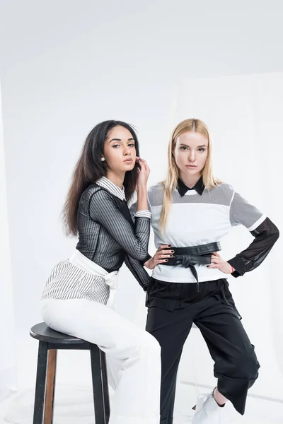 Attractive Multiethnic Women Black White Clothes Sitting Chairs White — Free Stock Photo