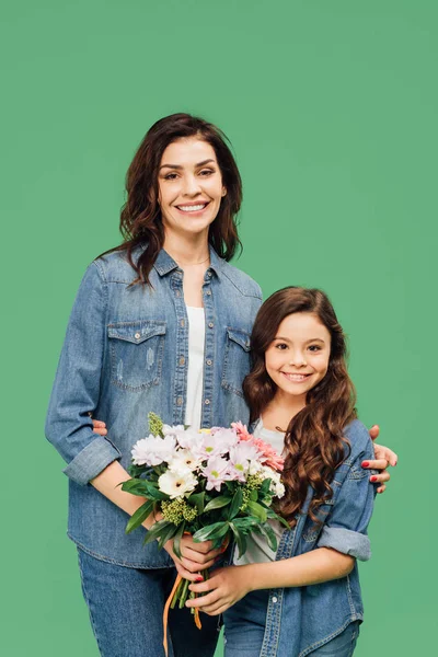 Happy Mother Daughter Denim Holding Flowers Looking Camera Isolated Green — Stock Photo, Image