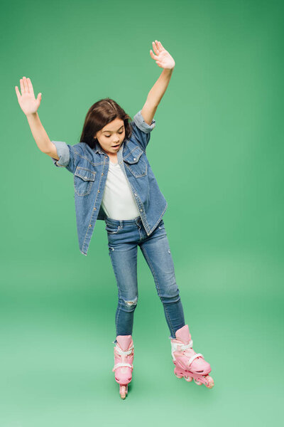 child rollerblading with outstretched hands on green background