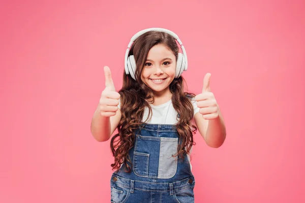 Smiling Kid Headphones Showing Thumbs Isolated Pink — Stock Photo, Image