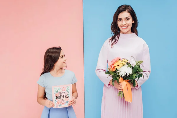 Adorable Child Attractive Woman Holding Gifts Blue Pink Background — Stock Photo, Image