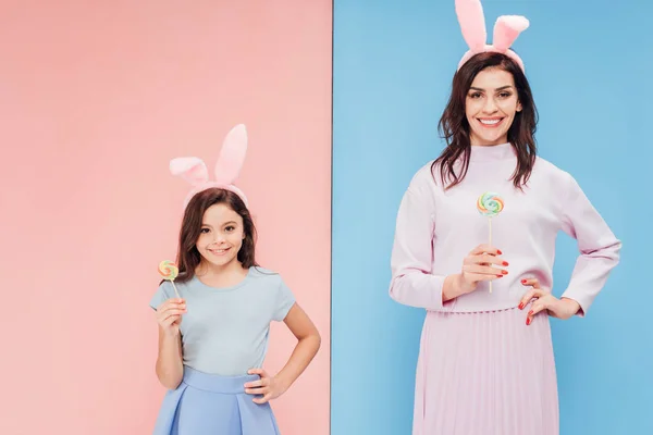 Beautiful Woman Child Bunny Ears Holding Candies While Looking Camera — Stock Photo, Image