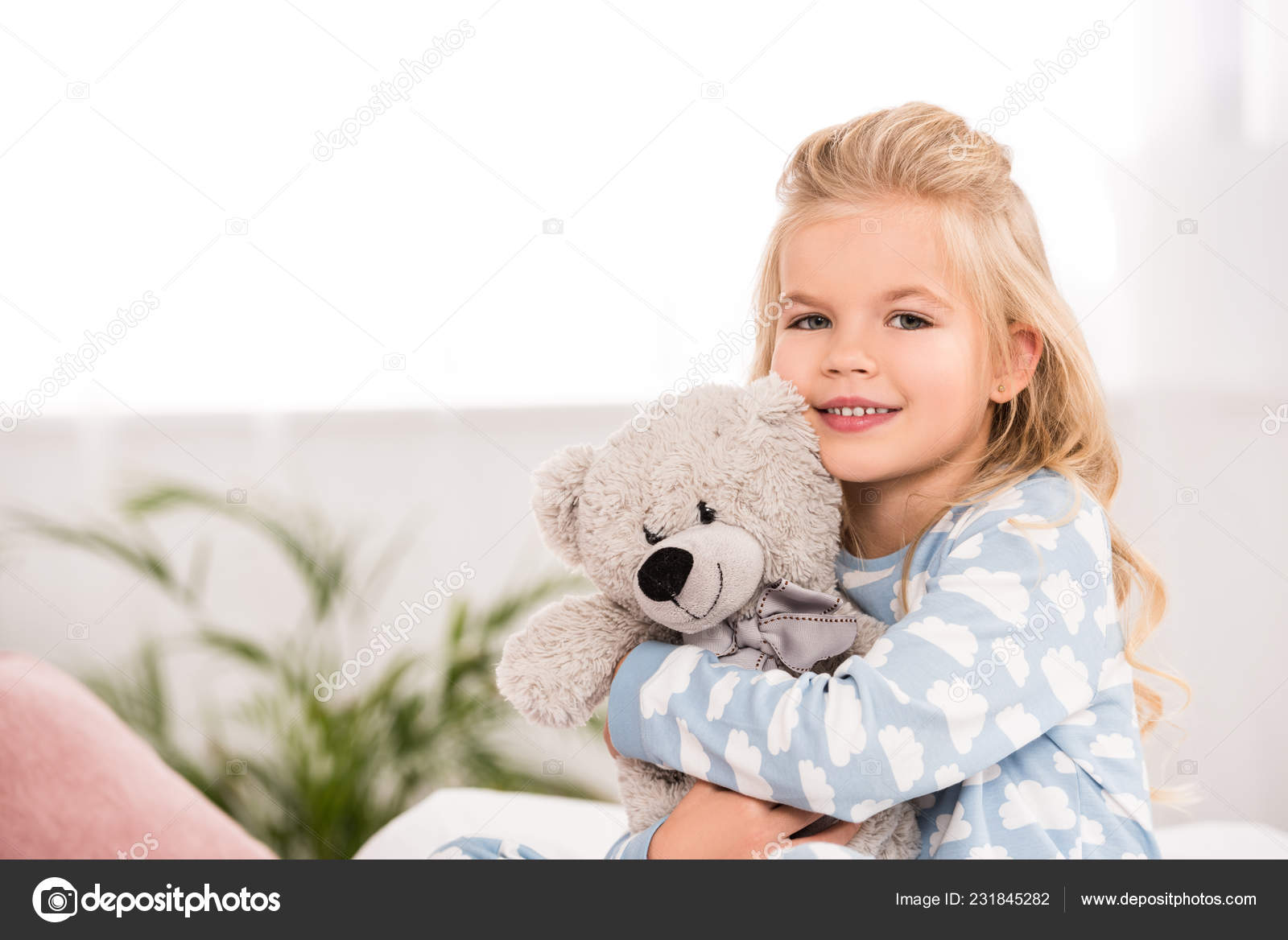 child with teddy bear