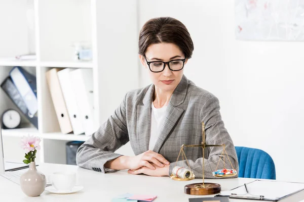 Attractive Lawyer Looking Justice Scales Money Drugs Table Office — Stock Photo, Image