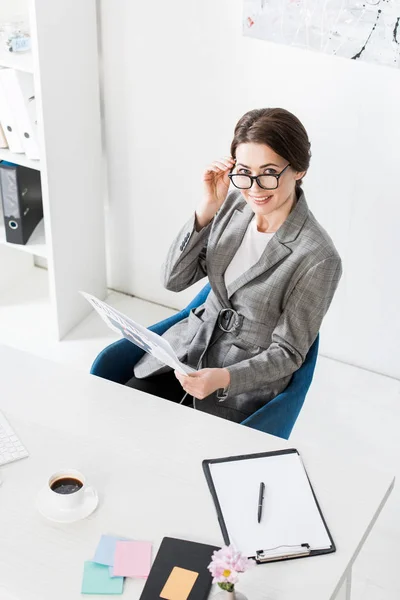 High Angle View Smiling Attractive Businesswoman Glasses Holding Newspaper Office — Stock Photo, Image