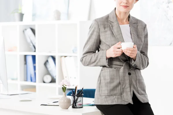 Cropped Image Businesswoman Grey Suit Sitting Table Holding Cup Coffee — Stock Photo, Image