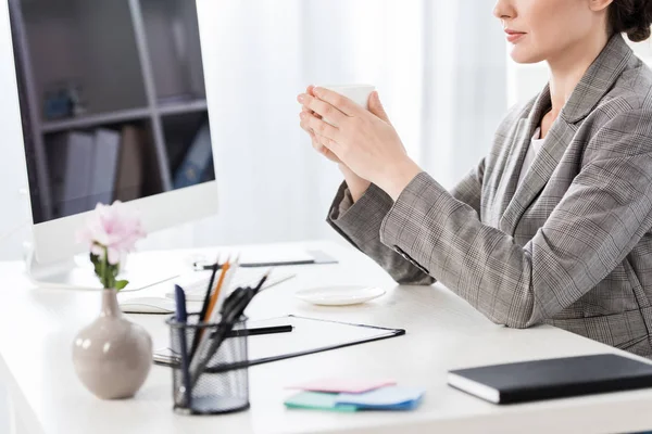 Cropped Image Businesswoman Grey Suit Holding Cup Coffee Table Office — Stock Photo, Image