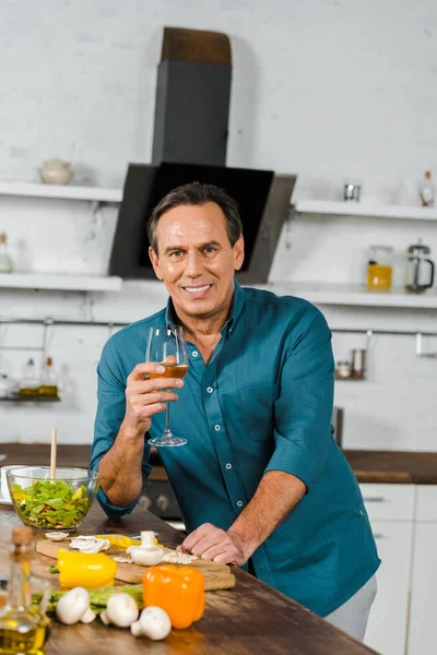 Smiling Handsome Mature Man Holding Glass Wine Looking Camera Kitchen — Stock Photo, Image