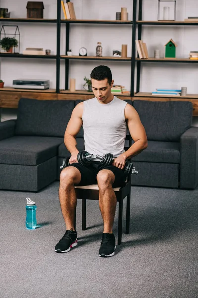 Mixed Race Athlete Sitting Dumbbells Chair Home Gym — Stock Photo, Image