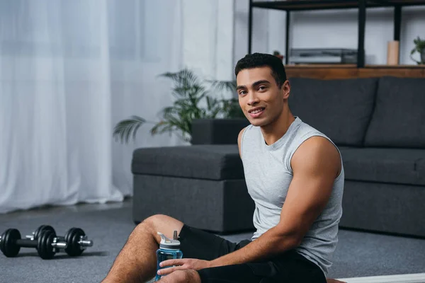 Happy Racial Man Sitting Sport Bottle Home Gym — Stock Photo, Image