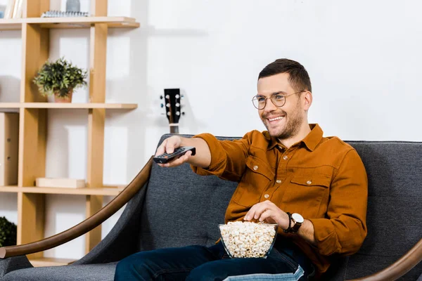 Handsome Man Sitting Sofa Popcorn Bowl Holding Remote Control — Stock Photo, Image