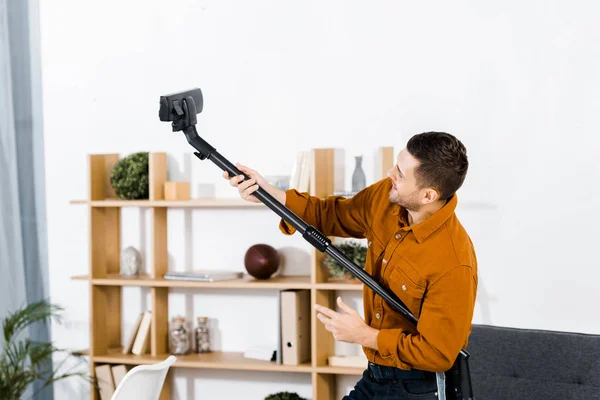 Handsome Man Modern Living Room Rising Hoover — Stock Photo, Image