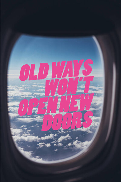 view of blue cloudy sky from airplane with "old ways wont open new doors" quote on window