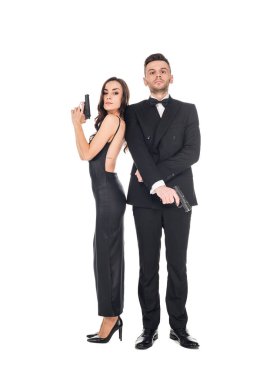 elegant couple of secret agents in black clothes posing with guns, isolated on white clipart