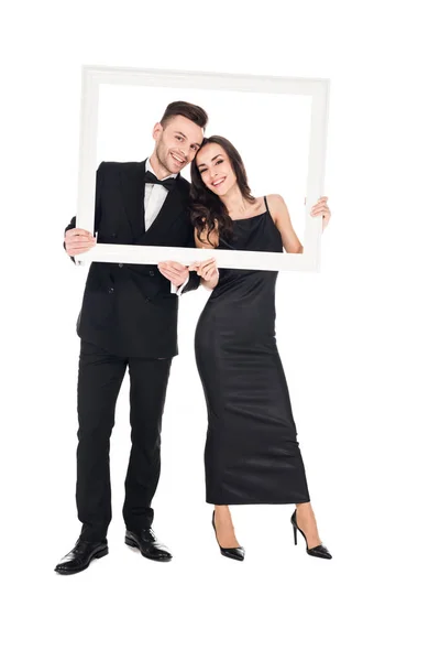 Feliz Casal Elegante Roupas Pretas Posando Com Moldura Isolado Branco — Fotografia de Stock