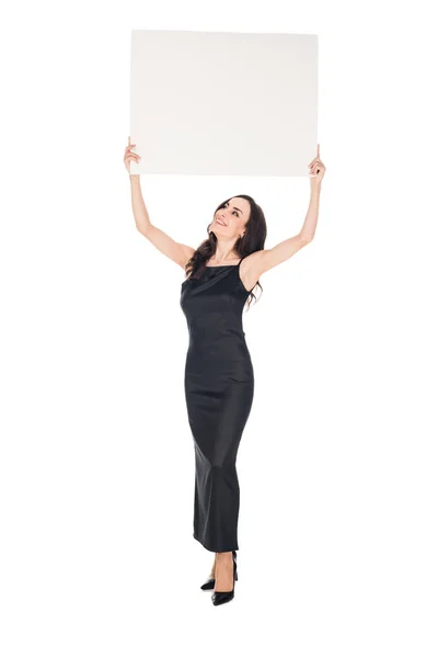 Елегантна Жінка Чорній Сукні Позує Порожнім Плакатом Ізольована Білому — стокове фото