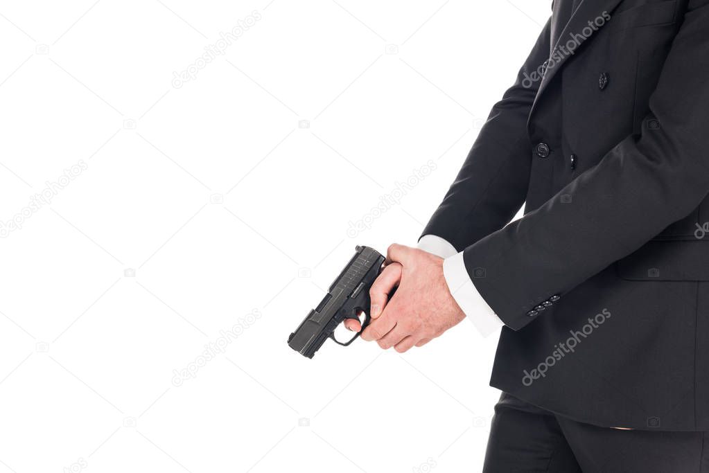 partial view of killer in black jacket holding gun, isolated on white