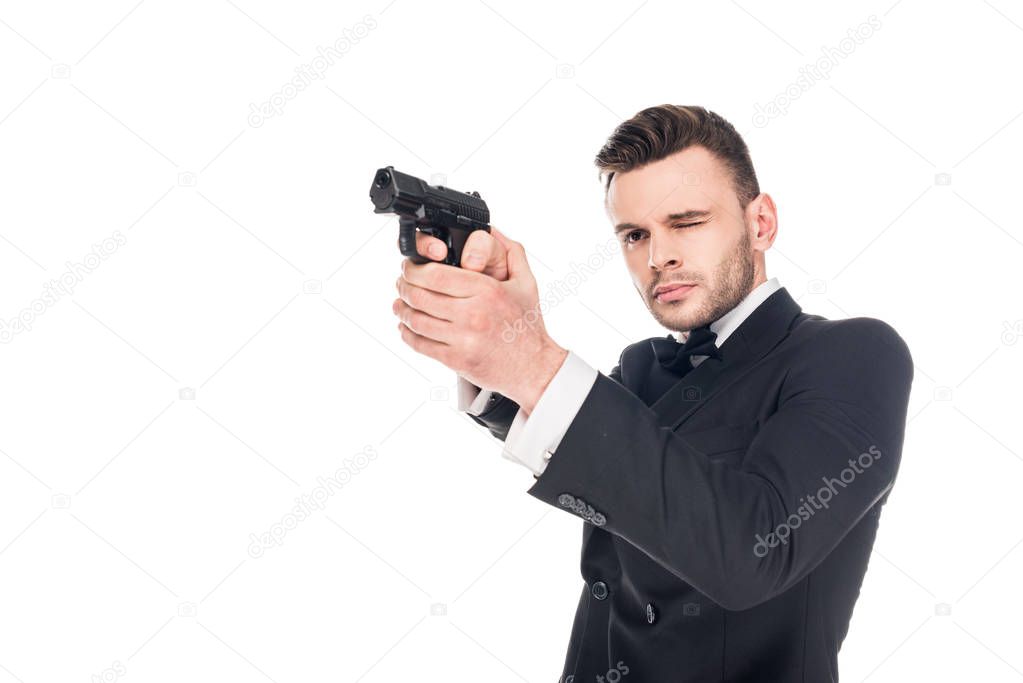 dangerous killer in black suit aiming with gun, isolated on white