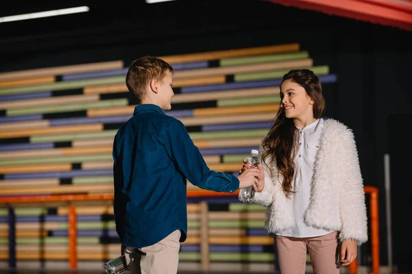 Selective Focus Pretty Boy Giving Beautiful Friend Bottle Water — Stock Photo, Image