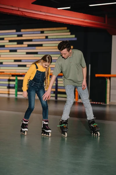 Handsome Young Instructor Showing Skating Technics Attentive Child — Stock Photo, Image