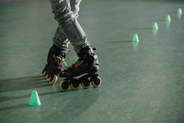 Cropped view of children legs in roller skates in special position