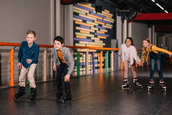 Joyful kids having fun while skating together