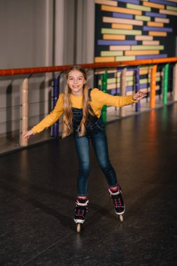Female roller skater in jeans enjoying childhood clipart