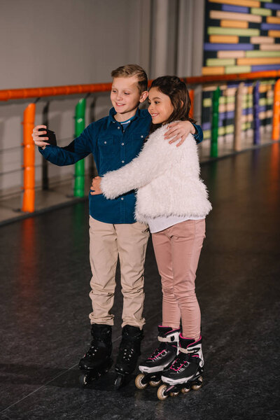 Full length shot of kids hugs and making selfie