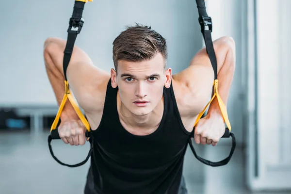 Handsome Muscular Young Man Exercising Suspension Straps Looking Camera Gym — Stock Photo, Image