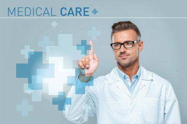 handsome scientist in white coat and glasses touching medical care interface in air isolated on grey, artificial intelligence concept clipart