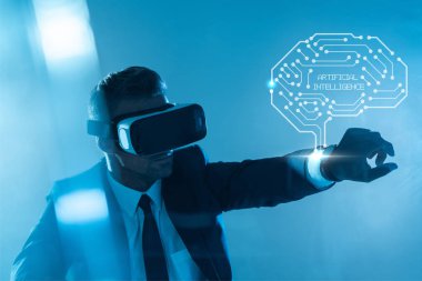 businessman in virtual reality headset with brain isolated on blue, artificial intelligence concept