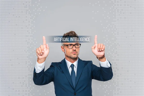 Handsome Businessman Glasses Touching Artificial Intelligence Lettering Isolated Grey — Stock Photo, Image
