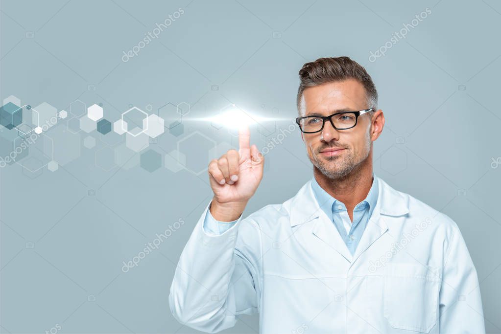 Handsome scientist in white coat and glasses touching technology interface in air isolated on grey, artificial intelligence concept