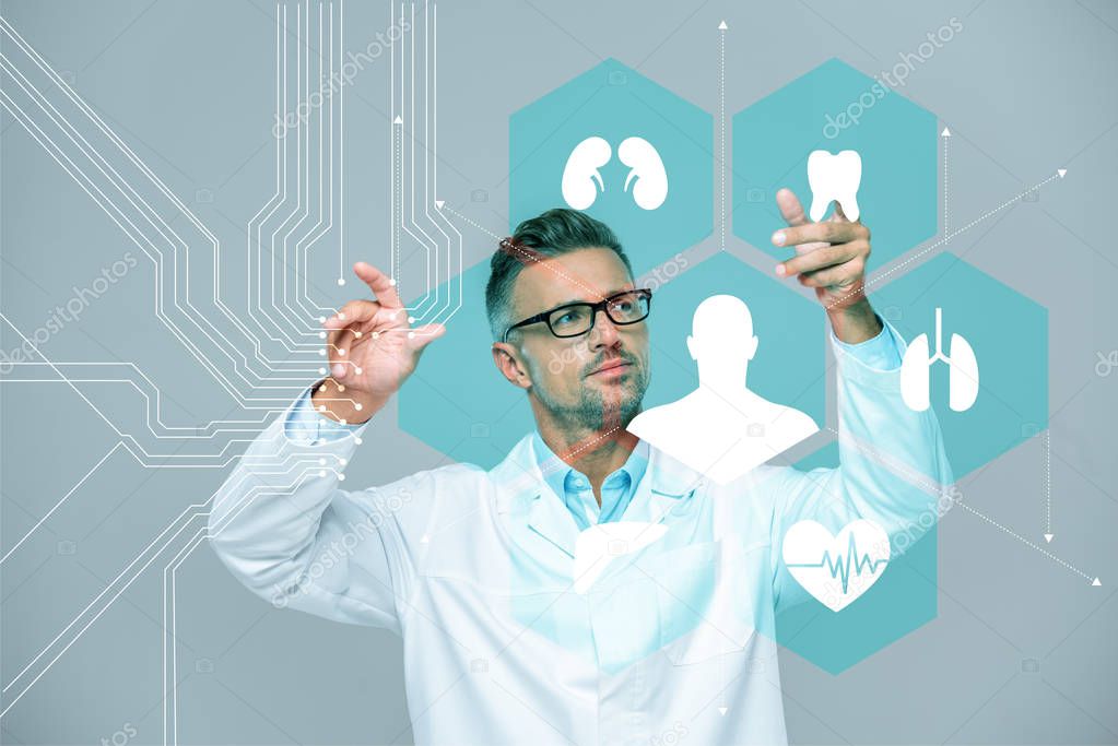 Handsome scientist in white coat and glasses moving medical interface in air isolated on white, artificial intelligence concept