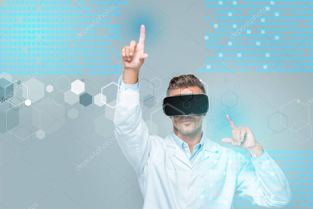 Scientist in virtual reality headset touching medical interface isolated on grey, artificial intelligence concept