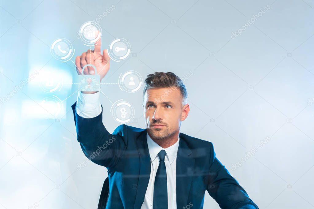 handsome businessman pointing on icons isolated on white, artificial intelligence concept