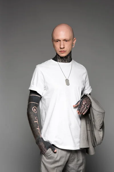 Serious Bald Tattooed Man White Shirt Holding Suit Jacket Isolated — Stock Photo, Image