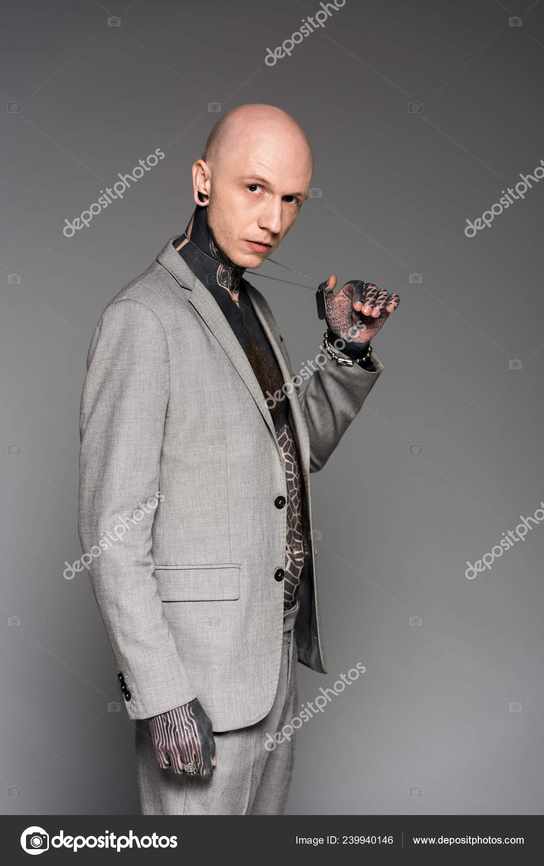 pic Handsome Bald Men In Suits side view handsome bald tattooed man suit holding dog tag stock photo image by c igorvetushko 239940146