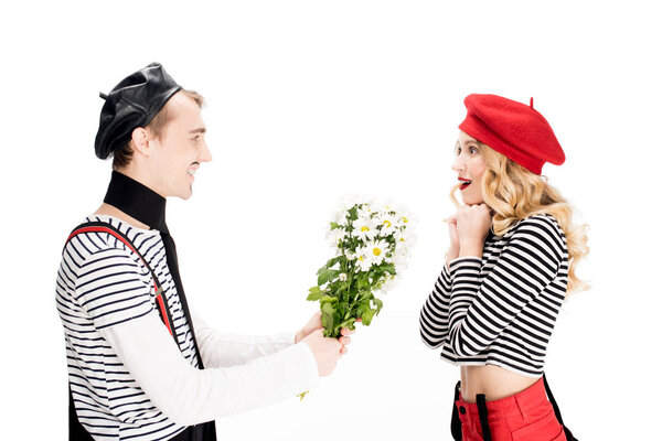 french man giving flowers to attractive woman in red beret isolated on white 