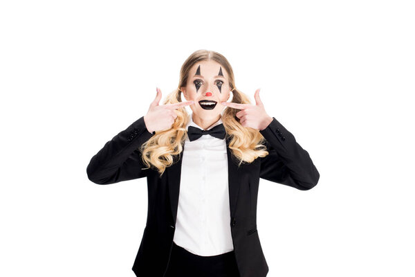 cheerful female clown in suit smiling isolated on white 