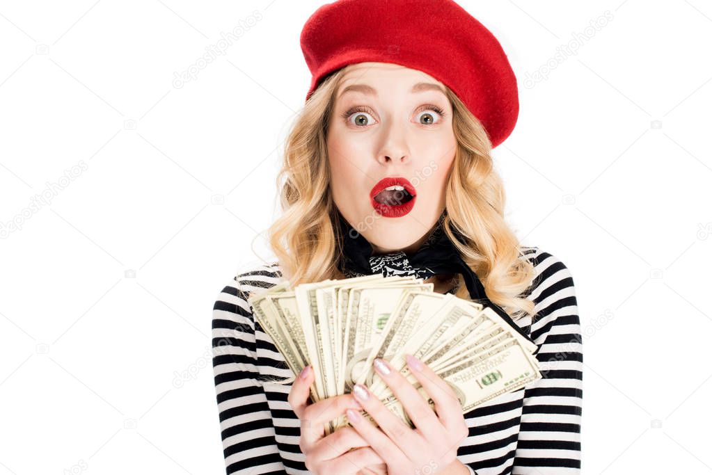 surprised blonde woman holding dollar banknotes in hands isolated on white 