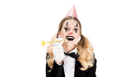 female clown in suit smiling while holding birthday blower isolated on white  clipart