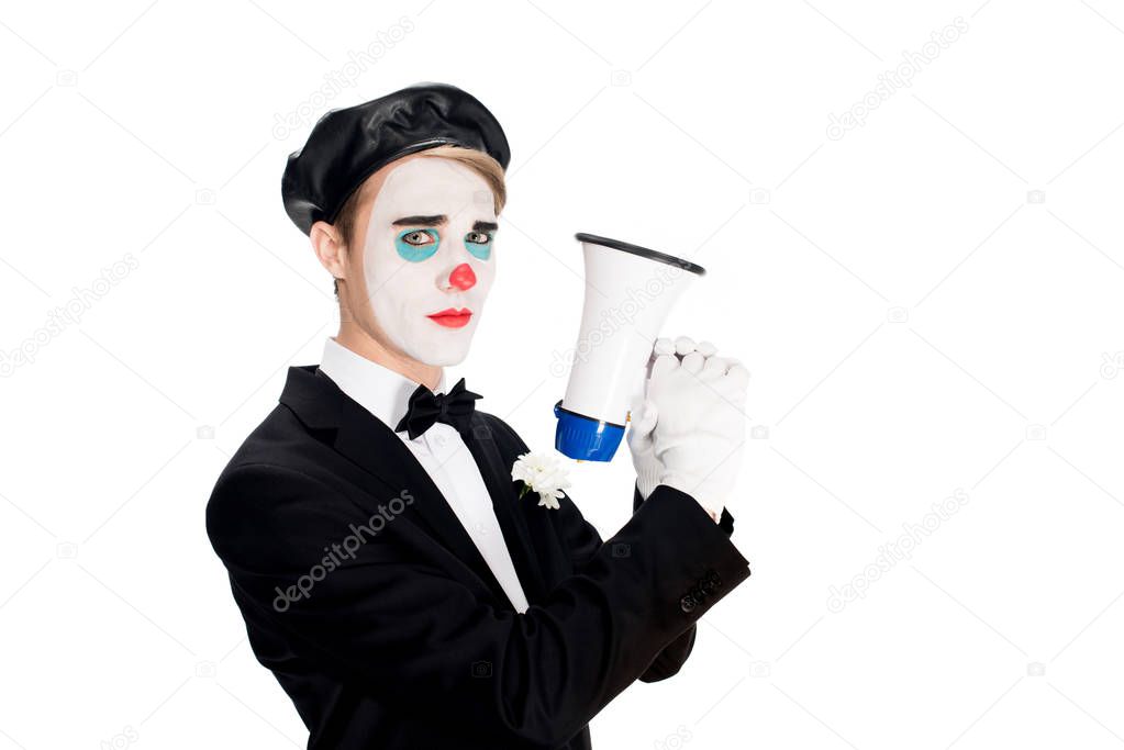 serious clown in suit and black beret holding megaphone isolated on white 