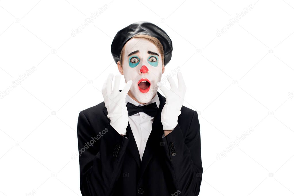 frightened clown wearing white gloves suit abnd black beret isolated on white 
