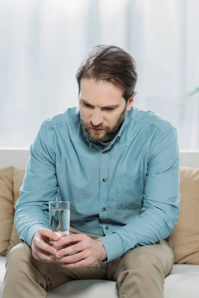 Upset Bearded Man Holding Glass Water Sitting Couch Psychotherapist Office — Stock Photo, Image