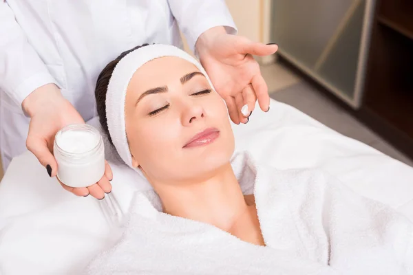 Beautician Holding Cosmetic Cream Bottle Puting Woman Face Beauty Salon — Stock Photo, Image